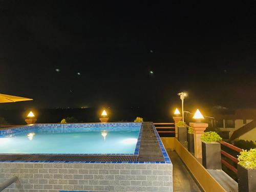 a large swimming pool at night with lights on it at Hotel Magdalina Lagoon in Negombo