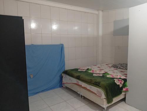 Postel nebo postele na pokoji v ubytování Kitnet de férias