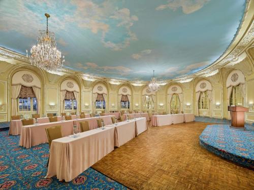 a large room with tables and a podium in it at Fairmont Copley Plaza in Boston