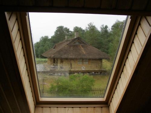 a view of a building through a window at Treimani Puhkemaja in Treimani