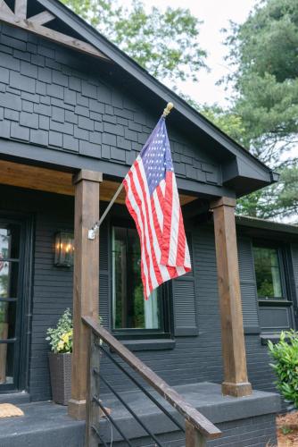 a american flag on the front of a house at Stylish Private Home 1 mile from Downtown Franklin in Franklin