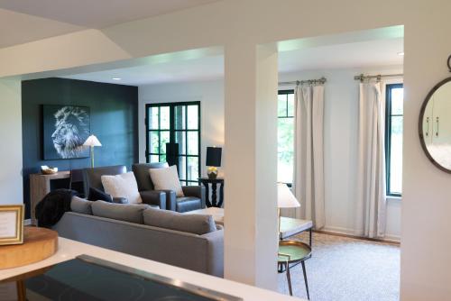 a living room with a couch and a table at Stylish Private Home 1 mile from Downtown Franklin in Franklin
