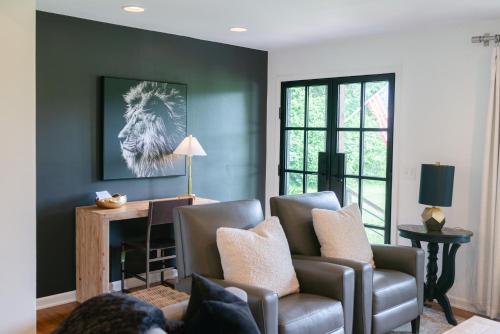 a living room with two chairs and a couch at Stylish Private Home 1 mile from Downtown Franklin in Franklin