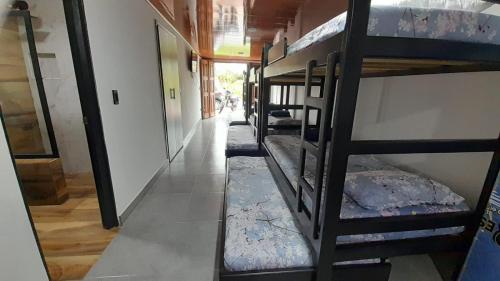a group of bunk beds in a room at HOSTAL RANCHO JOTA Murillo Tolima in Murillo