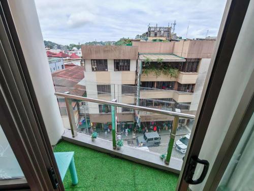 a view from a window of a building at Condotel in Baguio City in Baguio
