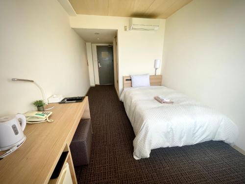 Katil atau katil-katil dalam bilik di Amakusa Onsen Hotel Shikisakikan