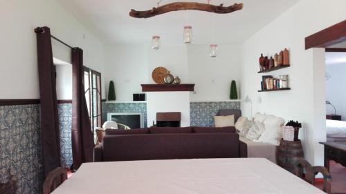 a living room with a couch and a table at Quinta Santa Ana in Setúbal
