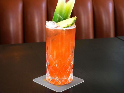a drink sitting on a table with a garnishment at Fairmont Pittsburgh in Pittsburgh