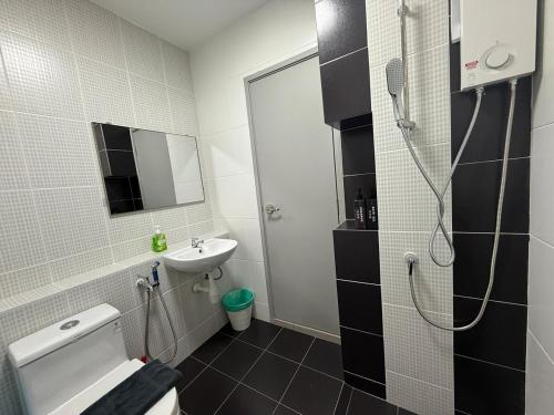 a bathroom with a shower and a toilet and a sink at MountAustin Projector 3BR 8pax NEW in Johor Bahru