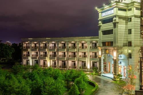 a building with a clock tower on top of it at Hualien Toongmao Resort in Jian