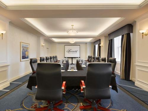 a conference room with a long table and chairs at Fairmont Hotel Vancouver in Vancouver
