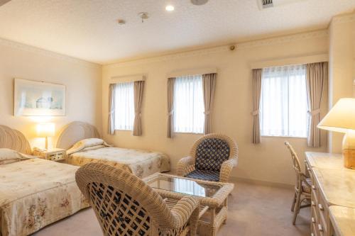 Postel nebo postele na pokoji v ubytování Auberge Le Temps