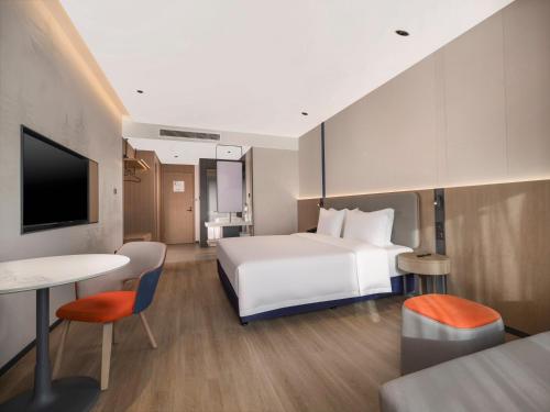 Ένα ή περισσότερα κρεβάτια σε δωμάτιο στο Holiday Inn Express Aksu by IHG