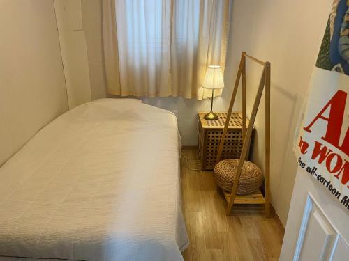 Postel nebo postele na pokoji v ubytování cozyslowstay