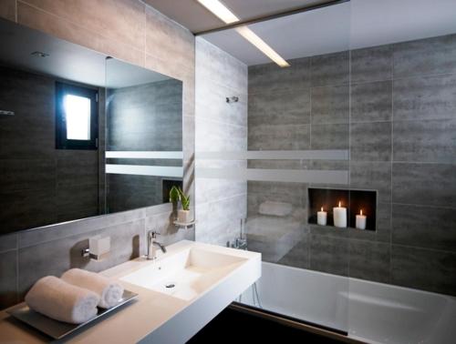 a bathroom with a sink and a fireplace at Tesoro Blu Hotel & Spa Adults Only in Skala Kefalonias