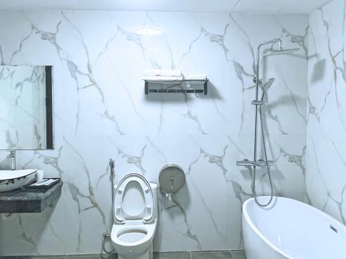 Koupelna v ubytování GRAD Queen Urban Mo Lao