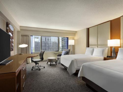 Un ou plusieurs lits dans un hébergement de l'établissement Swissotel Chicago