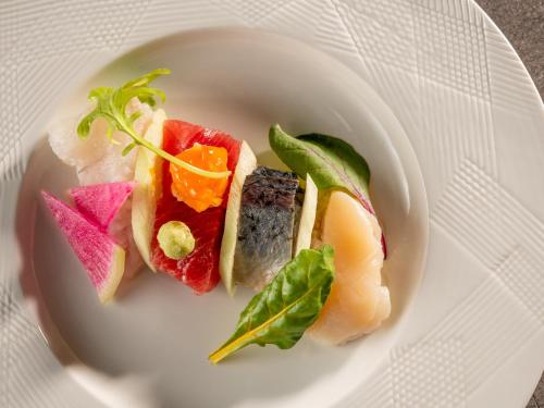 a plate with three different types of food on it at KAMENOI HOTEL Ome in Ome