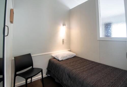 Ένα ή περισσότερα κρεβάτια σε δωμάτιο στο Aura Accommodation
