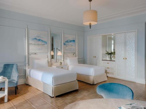 Ένα ή περισσότερα κρεβάτια σε δωμάτιο στο Fairmont Le Montreux Palace