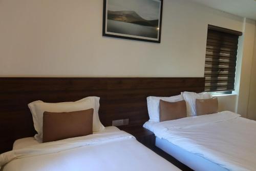 Postel nebo postele na pokoji v ubytování Monoi Suite Nha Trang