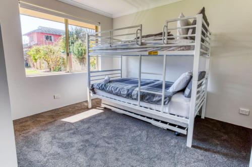 Ένα ή περισσότερα κρεβάτια σε δωμάτιο στο Marine Holiday Home - Geographe