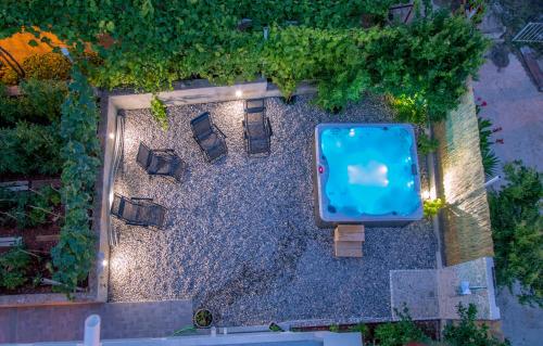 an overhead view of a pool in a garden at night at Green Lagoon, Hvar island in Vrboska