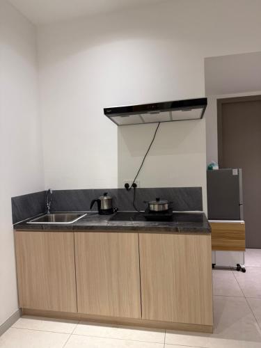 Kuchyň nebo kuchyňský kout v ubytování Bay Suites Home By Sea JQ 海的家