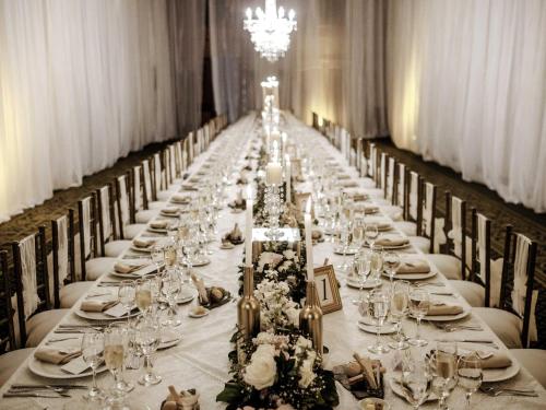 a long table is set up for a banquet at Swissotel Quito in Quito
