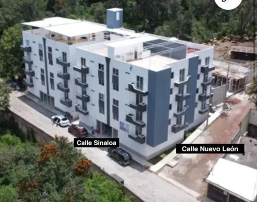 an overhead view of a building with the words calle shambara and call at Casa Karantani in Pátzcuaro