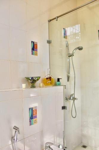 a bathroom with a shower and a sink at Tropical Terrace Negombo in Negombo