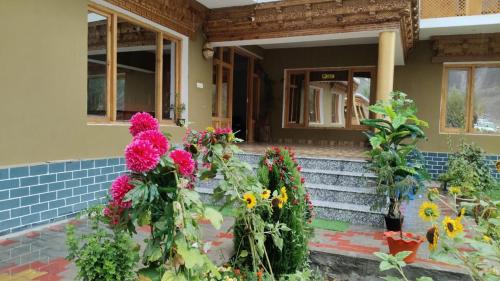 a house with flowers on the front steps at Himalayan Desert Villa, Hunder in Hundar
