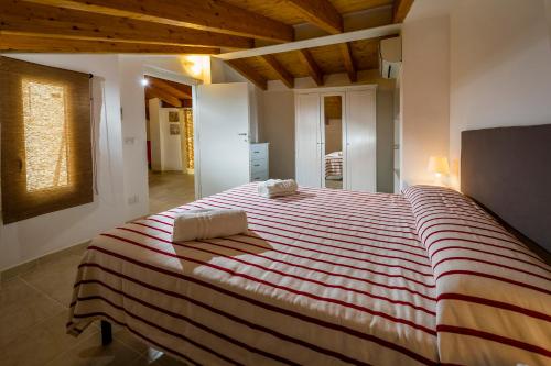 En eller flere senge i et værelse på Affittacamere Amunì