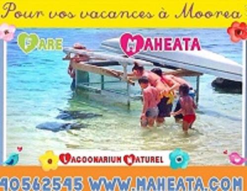 a poster of children in the water at a pier at Fare Maheata in Pihaena