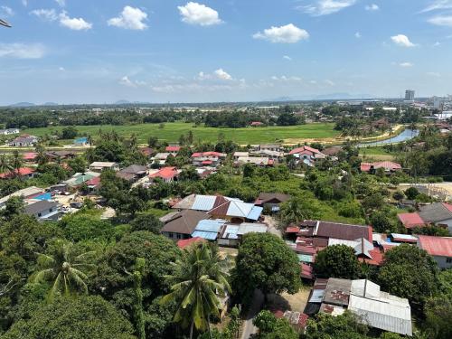 an aerial view of a small village with houses at The Viana Apartment 1 in Kota Bharu