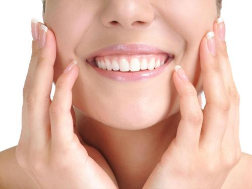 a woman smiling with her hands on her face at Swissotel Sydney in Sydney