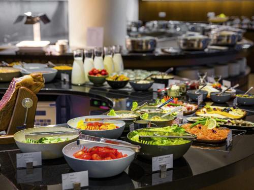 a buffet line with many different types of food at Swissotel Tallinn in Tallinn