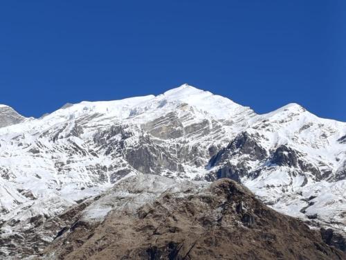 a mountain covered in snow and white at Hotel Srijana & Thakali Kitchen in Lete