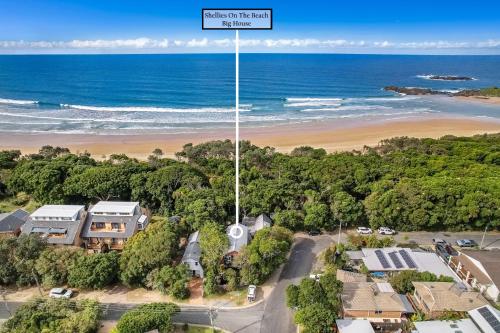 an aerial view of a house on the beach next to the ocean at Shellies Twin Beach Houses in Sawtell