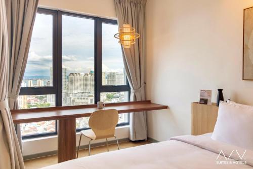 a bedroom with a desk and a large window at 22 Macalisterz by ALV in George Town