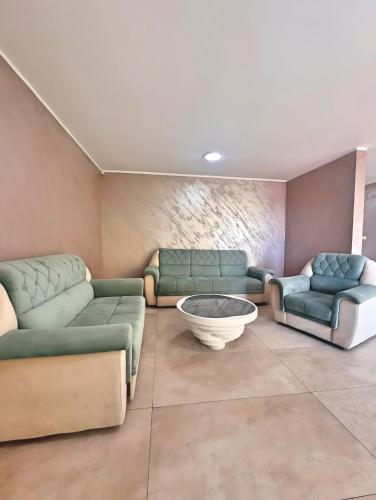 a waiting room with couches and a bowl in the middle at Villa Sava Dream in Beograd