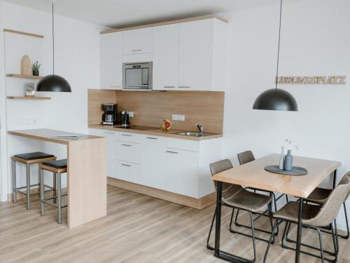 Kuchyň nebo kuchyňský kout v ubytování Haus NordQuartier