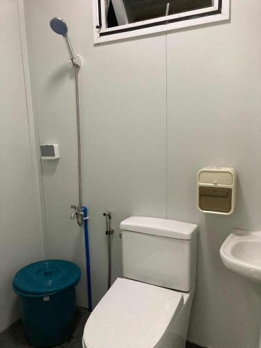 a small bathroom with a toilet and a window at Ays homestay in Puerto Princesa City