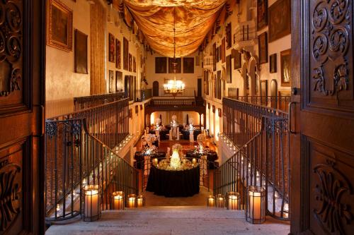 a hallway of a building with a table and candles at The Mission Inn Hotel and Spa in Riverside