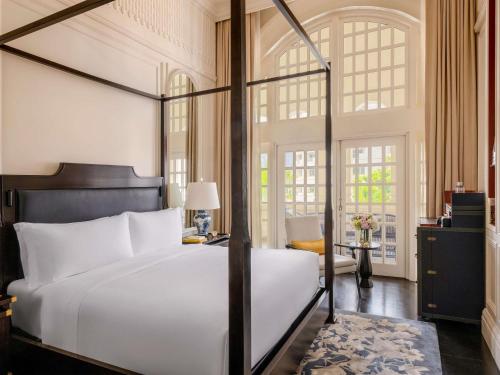 Cama o camas de una habitación en Raffles Singapore