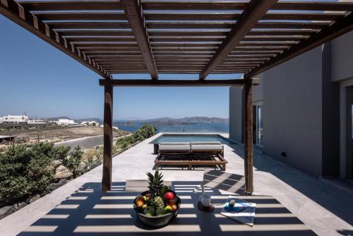 a view from the patio of a house with a pool at Melidonia Suites in Akrotiri