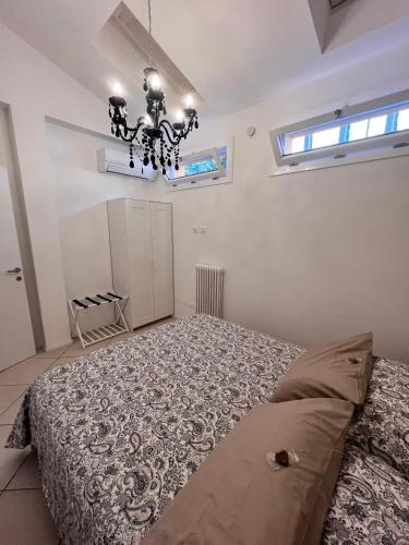 Ένα ή περισσότερα κρεβάτια σε δωμάτιο στο Saragozza 223 Deluxe Apartment