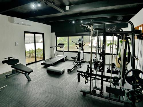 a gym with several exercise equipment in a room at Hilton Homestead by ANEW in Hilton