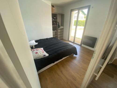 Postel nebo postele na pokoji v ubytování Maison du Lanot