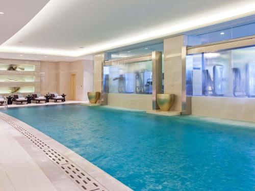 a large swimming pool in a hotel room at Fairmont Yangcheng Lake in Kunshan